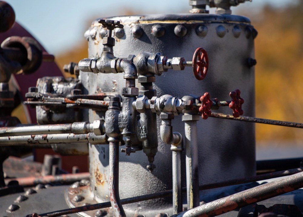 Pipes and red valves on an industrial line