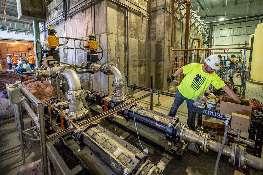 Plumber working on an industrial pipeline