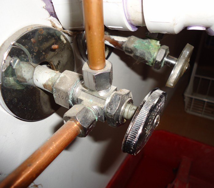 Water valve and pipe under a sink